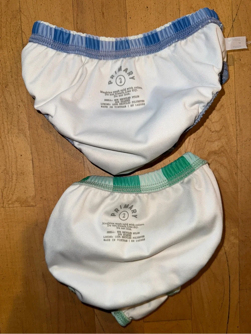 Bundle of two Primary Baby Swim Diaper size 2 blue checkered and green stripe
